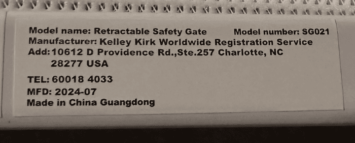 Retractable Safety Gate and "Model number: SG021" are printed on a white label located on the inside of the gate's frame.