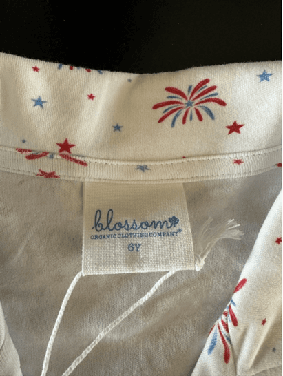 "Blossom" and the size are printed on the sewn-in neck label