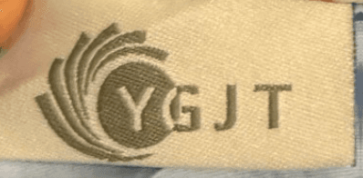 "YGJT" is printed on an attached label on the outside of the baby lounger's cover
